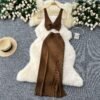A Two-piece Knitted Vest With A Slimming, Body-hugging, Slit Skirt