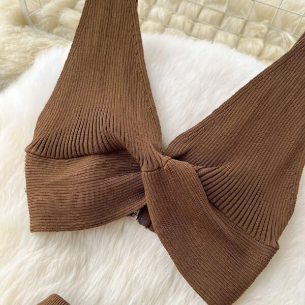 A Two-piece Knitted Vest With A Slimming, Body-hugging, Slit Skirt