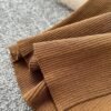 A Two-piece Knitted Vest With A Slimming, Body-hugging, Slit Skirt