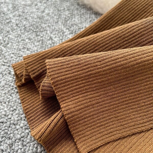 A Two-piece Knitted Vest With A Slimming, Body-hugging, Slit Skirt