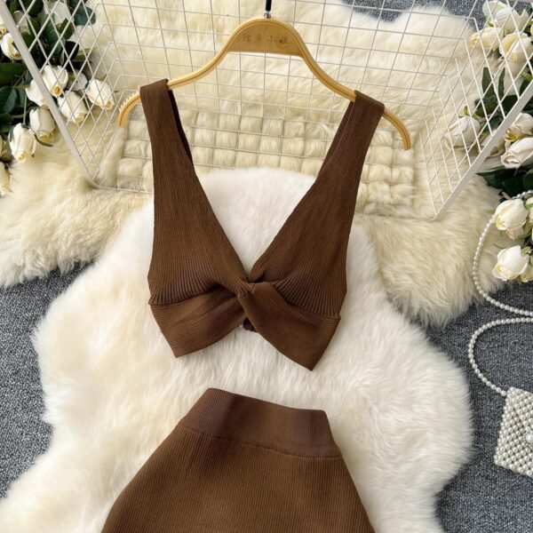 A Two-piece Knitted Vest With A Slimming, Body-hugging, Slit Skirt